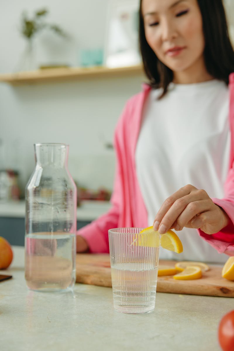Woman preparing healthy infused water for wellness